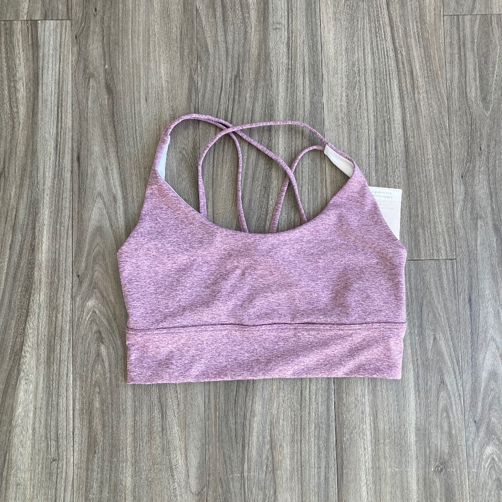 Onzie sports bra with criss cross detailing straps on back light purple
